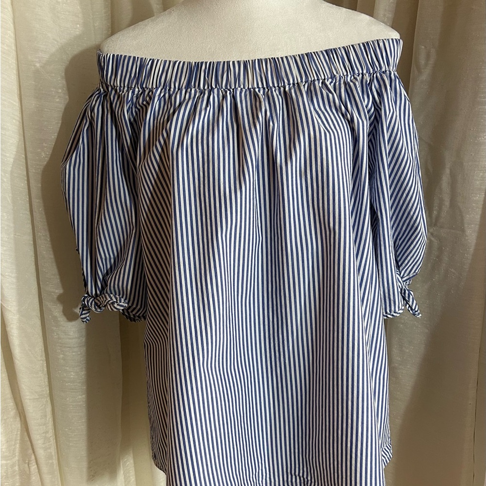 Cha Cha Vente off the shoulder blue and white striped blouse.